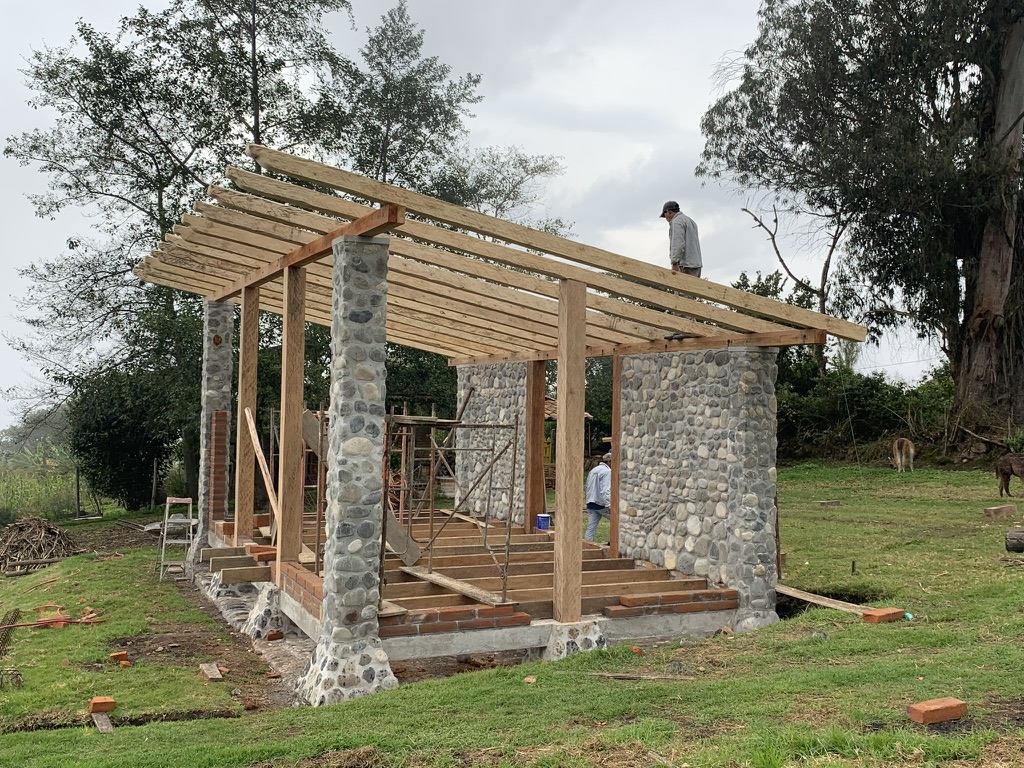 Roof rafters and joists laid across the stone and timber structure
