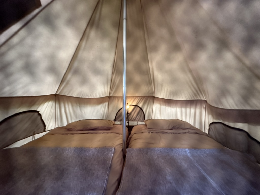 Glamping tent interior with valley views