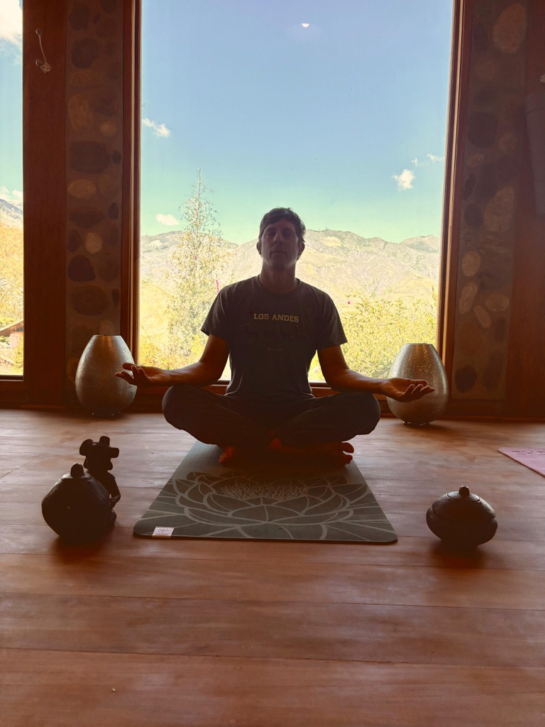 Morning yoga practice above the valley