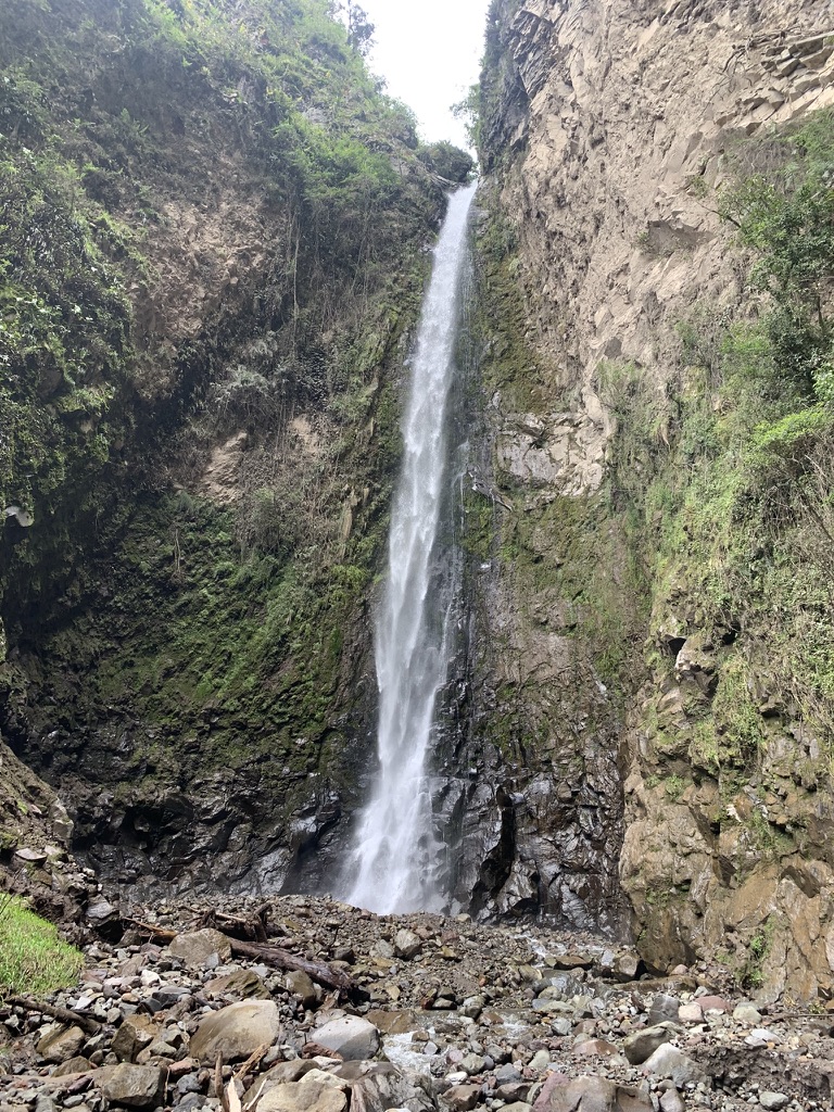 Tall waterfall in the canyon below the village