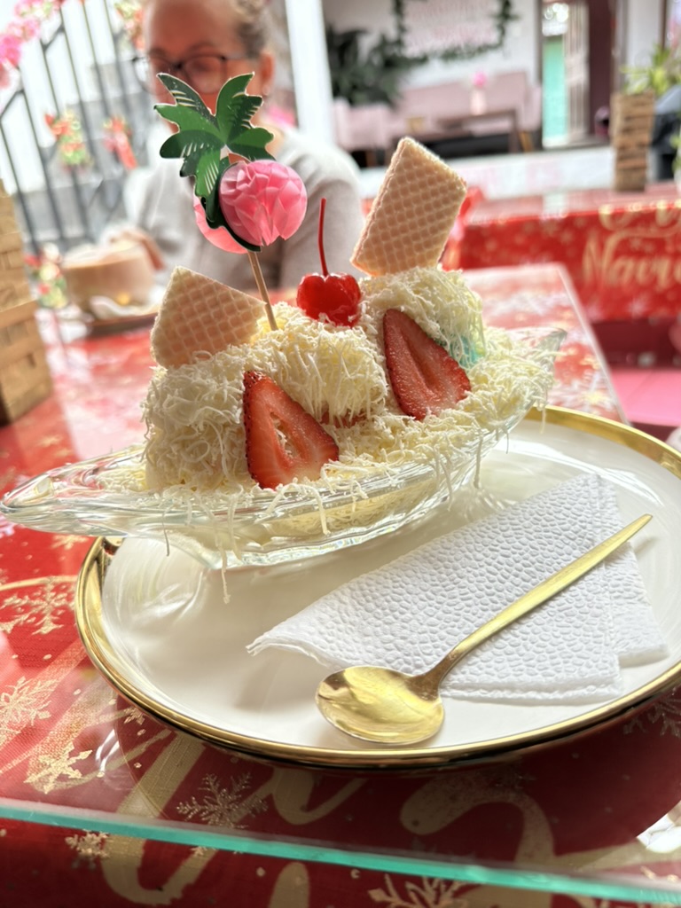 A strawberry and shredded-cheese dessert in a glass dish
